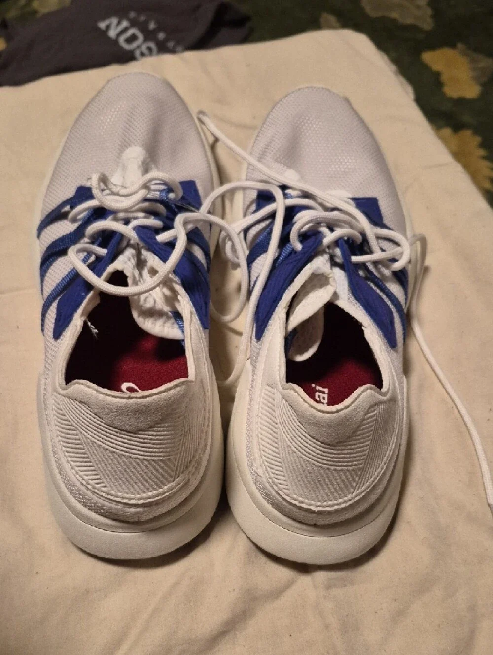 OluKai White Sneakers with Blue Webbing Accents